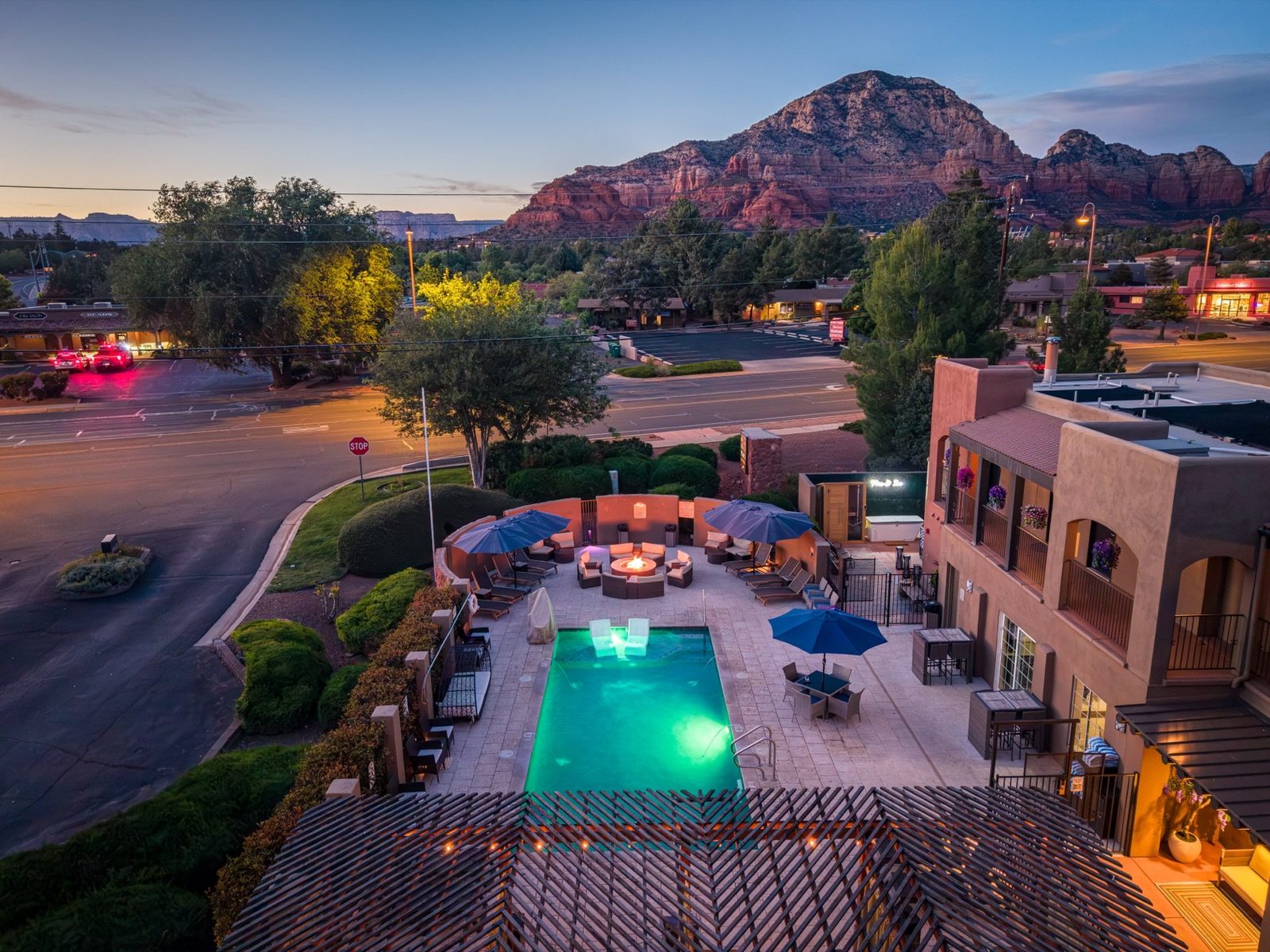 Arroyo Pinion exterior at dusk with red rock mountains in the background