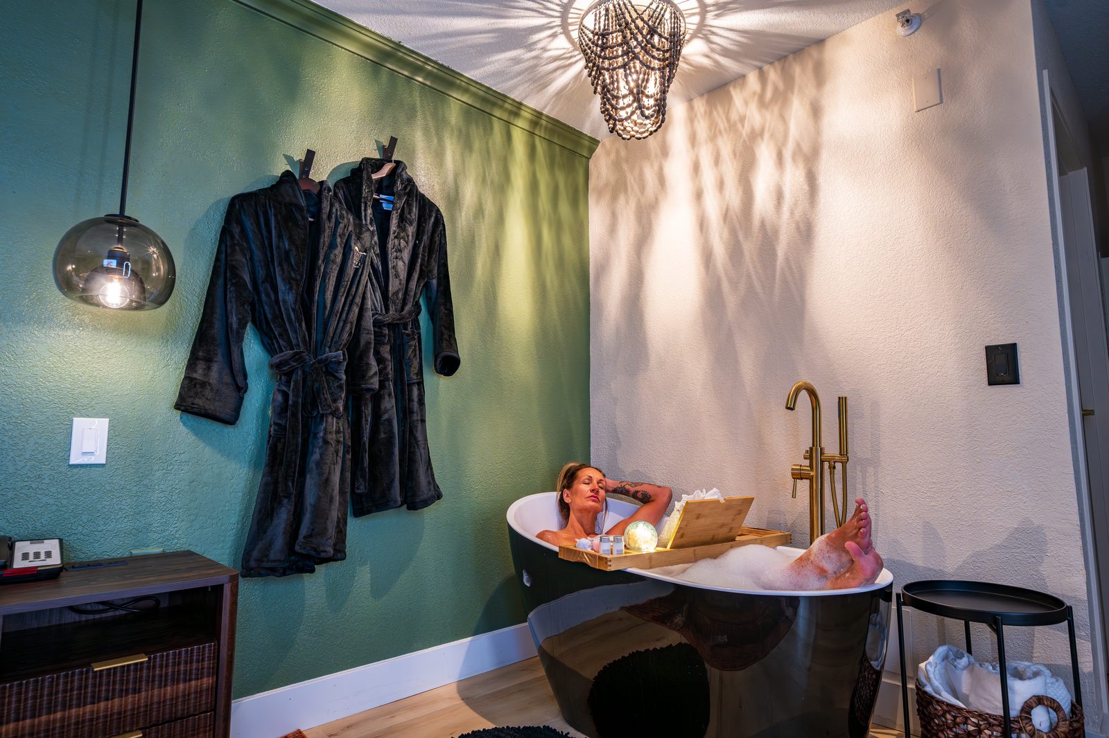 Guest relaxing in a private soaking tub